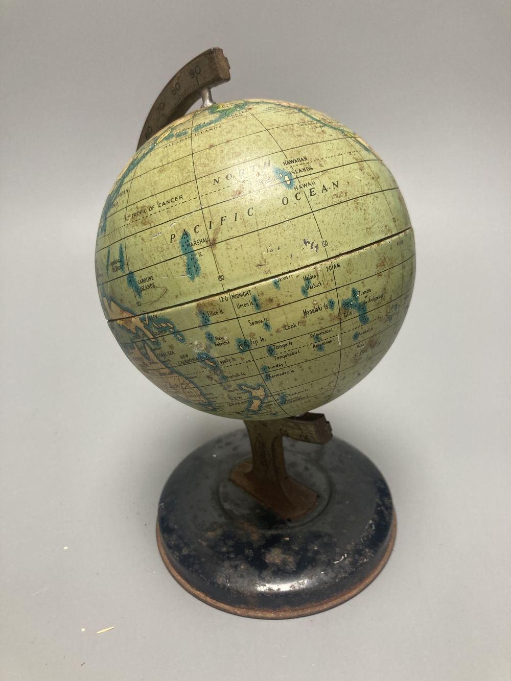 A Reliable Series lithographed tinplate revolving globe, 20cm, and two graphic globes,on ebonised wood bases, one by Philips